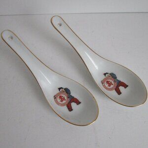 pair of porcelain soup spoons
